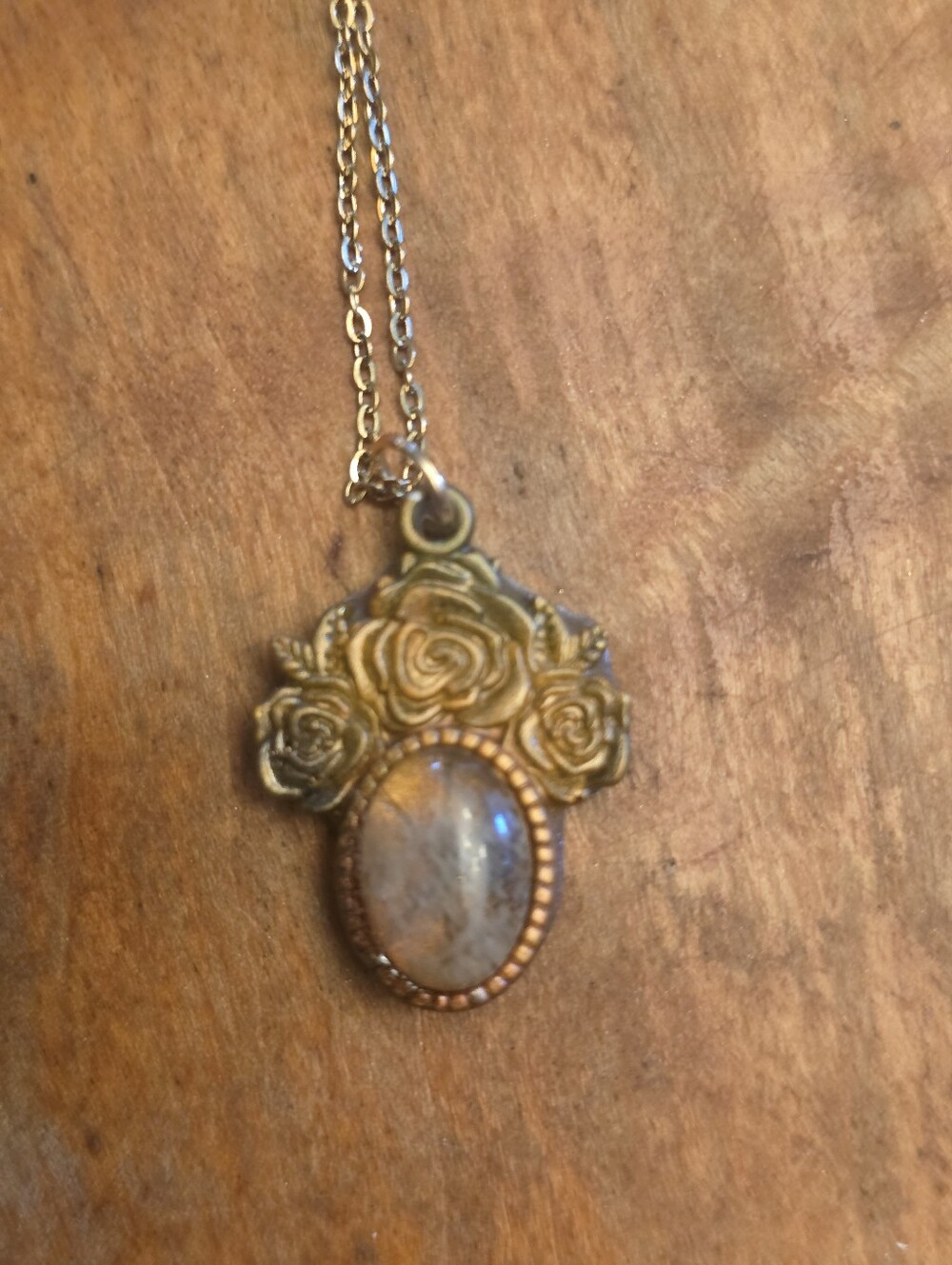 Clear Gemstone Inside A Gold Colored Resin Floral (Rose) Frame & Gold-Tone Chain
